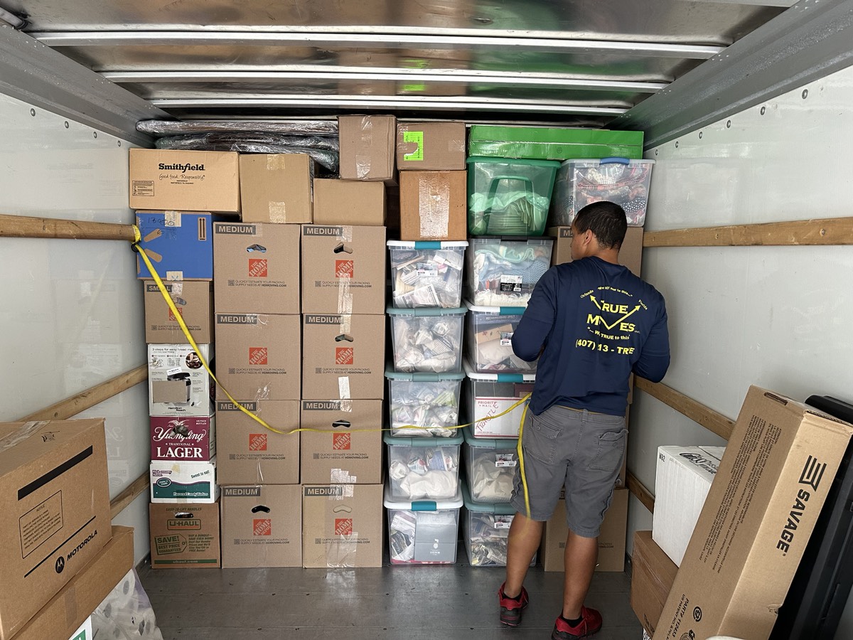 Neatly organized boxes loaded inside the moving truck