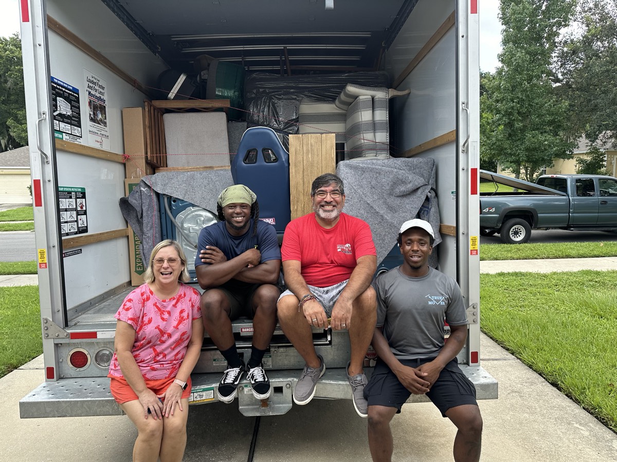 The True Moves crew with a happy customer